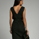 Fitted dress with V neckline and slit