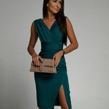 Fitted dress with V neckline and slit